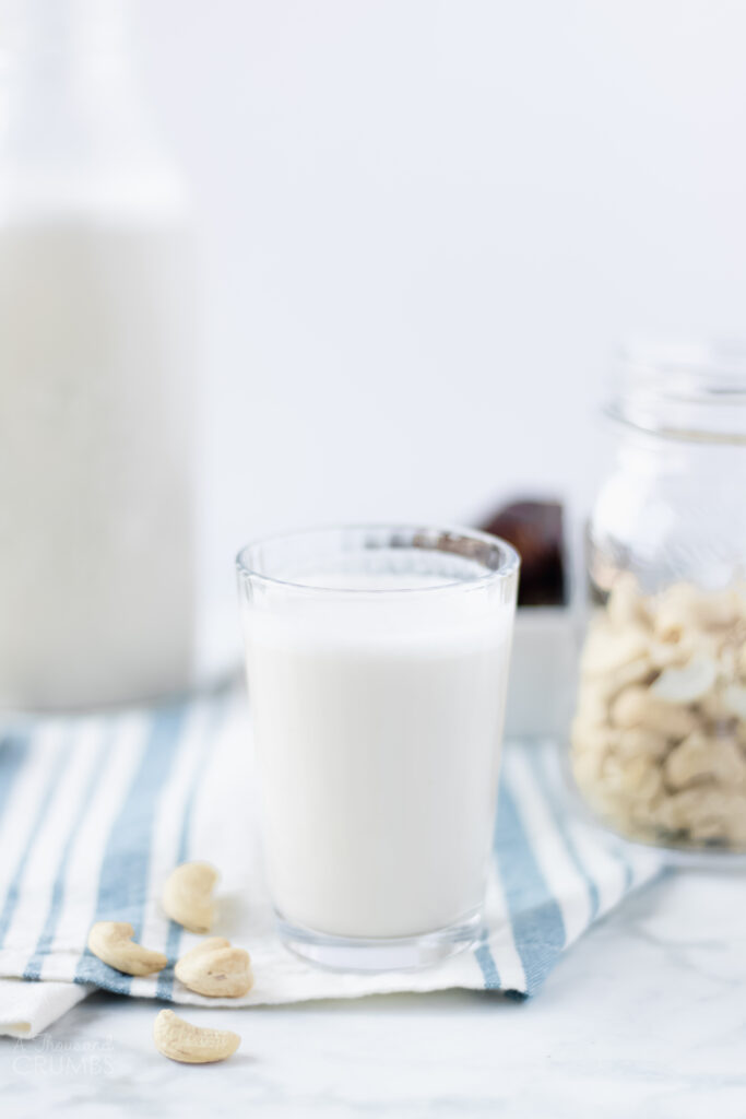 Easy and creamy homemade cashew milk is a great non-dairy milk alternative that requires no straining. Delicious in recipes, over cereal, or in your morning coffee. #athousandcrumbs #cashewmilk #nondairy #dairyfree #easyrecipe