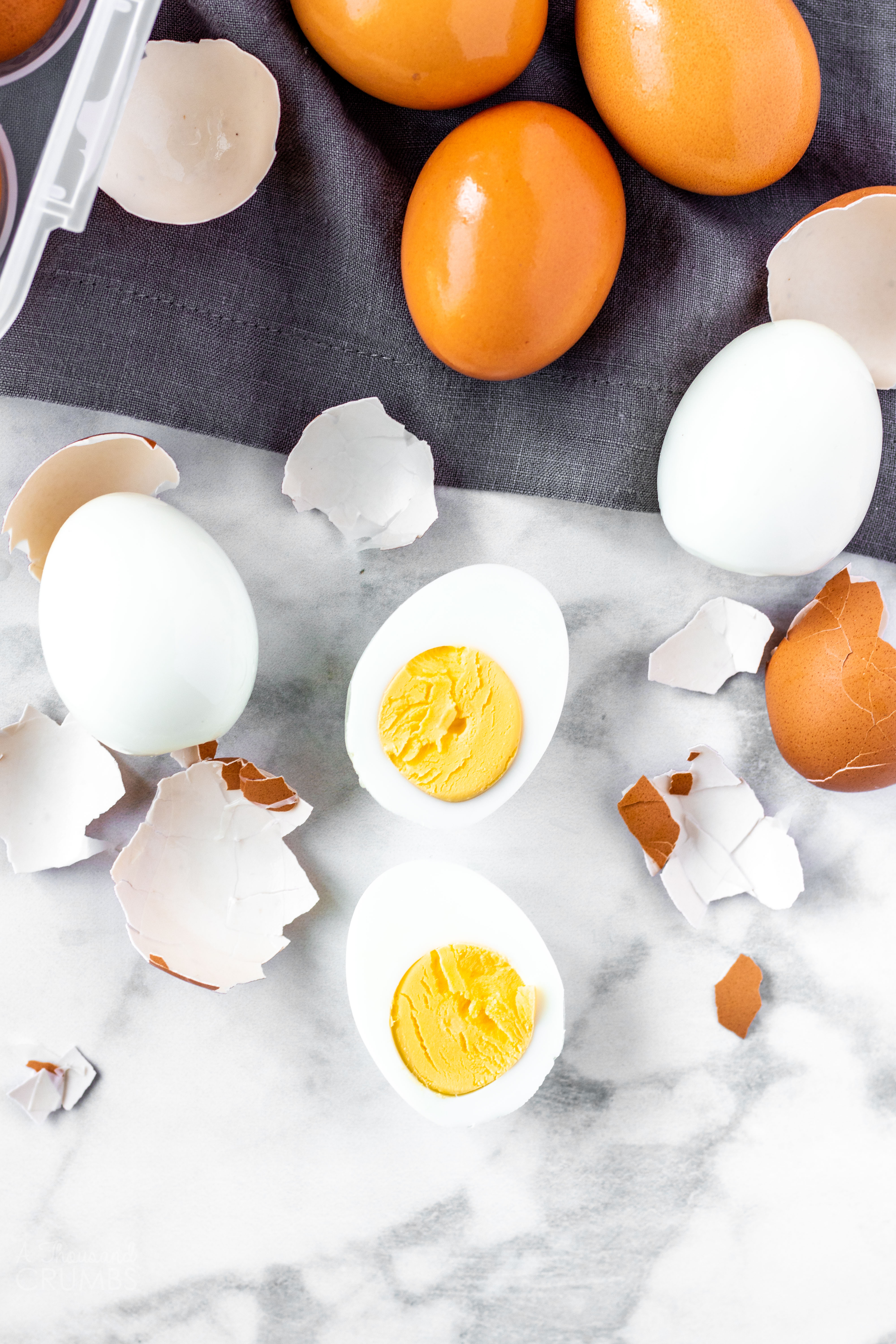 Easy to peel hard boiled eggs 2 ways – with and without an Instant Pot. #athousandcrumbs #hardboiledeggs #instantpot #easypeel #stovetop