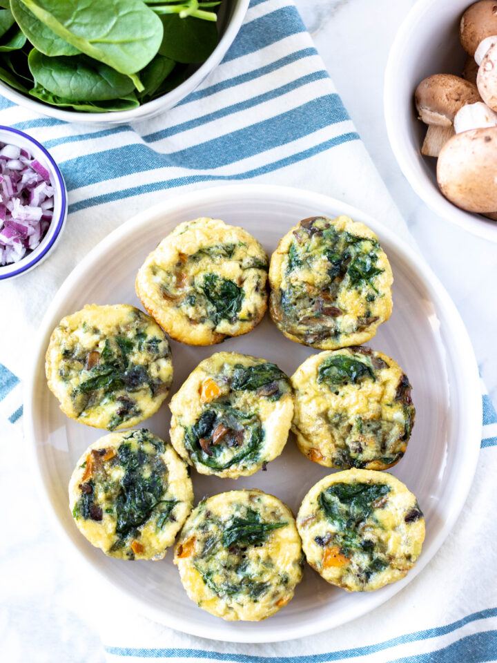 These easy egg muffins are full of flavor and healthy veggies. They are freezer-friendly and an easy grab-and-go breakfast. This egg muffin recipe is paleo, gluten-free, dairy-free, whole30, and keto friendly. #athousandcrumbs #eggmuffins #glutenfree #dairyfree #paleo #whole30 #keto